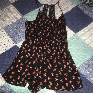 Black romper with red/orange flowers
